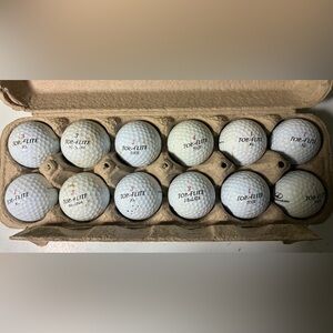 12Top-Flite White Golf Balls Set used
